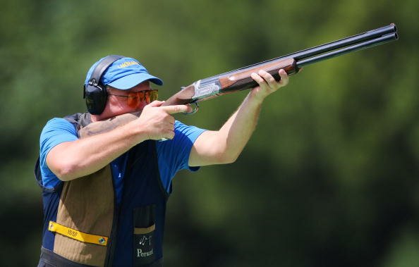 BEIJING - AUGUST 16: Mykola Milchev of Ukraine competes in the men's skeet shooting qualification event at the Beijing Shooting Range Hall on Day 8 of the Beijing 2008 Olympic Games on August 16, 2008 in Beijing, China. (Photo by Mike Hewitt/Getty Images)